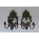 A Pair of 19th Century mirrored three light Sconces with bronzed finish and mask surmounts, 17 1/2