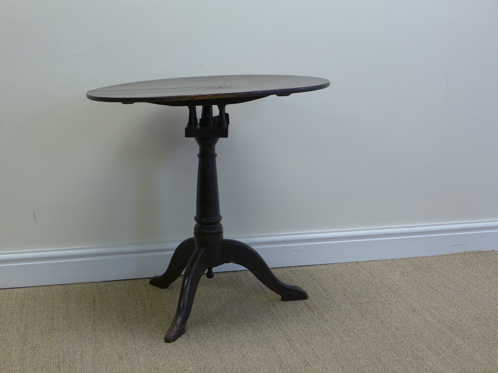 A late 18th Century oval oak Pillar Table with bird cage support on tapering column and tripod base