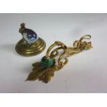 A 19th Century ormolu and malachite Desk Paper Clip floral engraved, 8in, and a brass Desk Weight