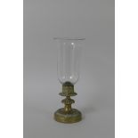 A 19th Century brass Candle Lantern with glass storm shade and scrolled motifs, 14in H