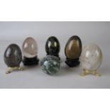 A Collection of six egg shaped polished mineral Ornaments including Jaspilite, Chalcopyrite,