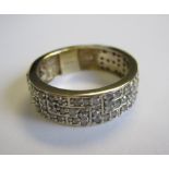 A Diamond Ring the wide band pavé-set numerous circular-cut stone in 9ct gold ring size Q