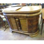 A continental Art Deco style walnut Sideboard with rounded ends, fitted slide and two bowed doors,