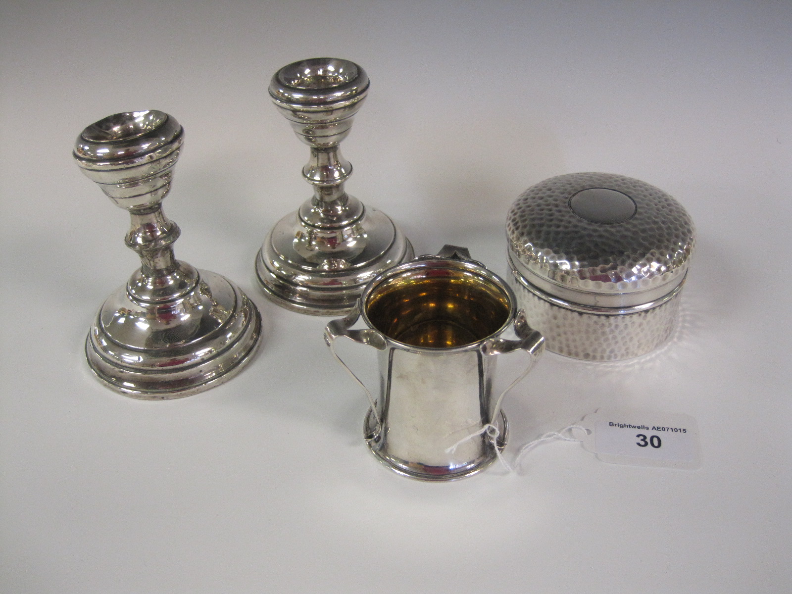 An Edward VII Art Nouveau silver three handled Tyg, London 1903, a hammered silver circular Box