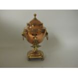 A small antique copper Samovar with urn finial, two ring handles and brass tap