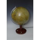 A twelve inch Terrestrial Globe Lamp on circular stand inset compass, 20in