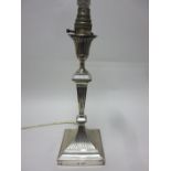 A Victorian silver Pillar Candlestick with fluted tapering column on square base, London 1894,