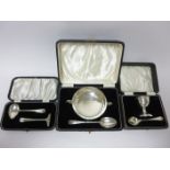 A George V silver two handled Christening Bowl and Spoon with hammered design, Birmingham 1932, a