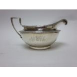 A George III silver Milk Jug of circular form engraved initials, London 1801, maker; J.E