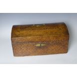 A 19th century leather covered small Trunk with domed lid having trellis decoration, 16in