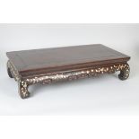 A Chinese low Stand in hardwood with mother of pearl inlaid decoration to the shaped frieze, 2ft 1in