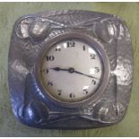 A Tudric pewter Mantel Clock with embossed floral designs, 4in square