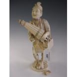 A Chinese carved ivory Figure of man holding parasol with bag over shoulder, 9 1/2in, signed