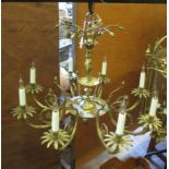 A gilt metal eight branch Chandelier with petal shaped sconces and figural column