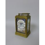 A 19th Century gilt brass and porcelain Carriage Clock, the porcelain dial marked with roman