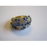 A Sapphire and Diamond Bomb Ring peg-set sapphire cabochons and brilliant-cut diamonds in 18ct gold,