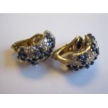 A pair of Sapphire and Diamond Bomb Earrings each peg-set sapphire cabochons and brilliant-cut