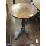 A George III oak Pillar Table, the star inlaid circular top above a vase turned column on a tripod