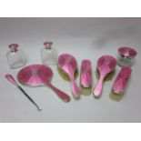 A George V silver and pink enamel Dressing Table Set named Vera, Birmingham 1924/5, 9 pieces