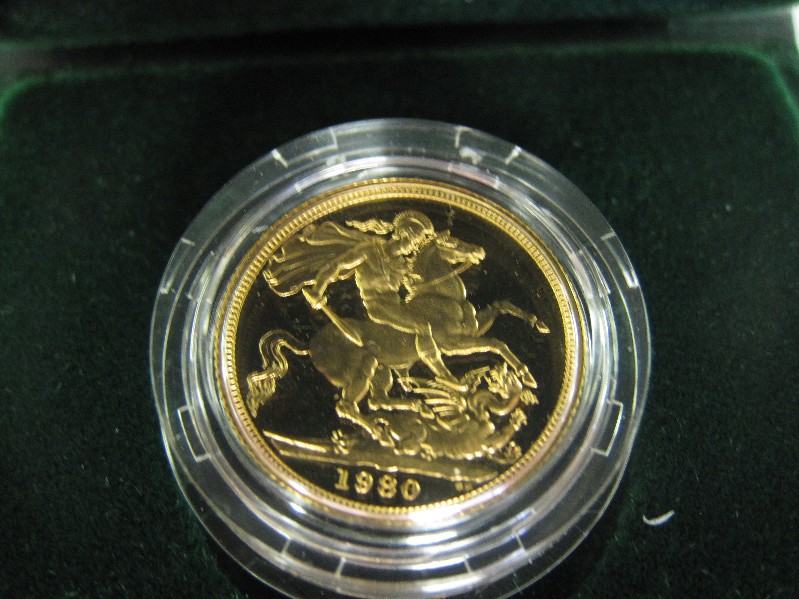 An Elizabeth II Proof Sovereign, 1980, in green case of issue