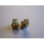 A pair of Diamond Ear Studs each claw-set brilliant-cut stone, total diamond weight 0.63cts, in 18ct