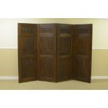 An antique oak four panelled Screen, the upper panel carved with arched detail, 6ft H