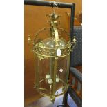 A large brass Hall Lantern with domed glass shade and pierced brass design, 3ft 2in H