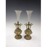 A pair of Eastern style Vases with flared glass trumpets on painted and gilt metal bases set
