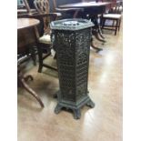 A black cast hexagonal Veritas Stove with ring handles, 2ft 6in H