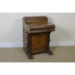 A Victorian burr walnut piano top Davenport with hinged stationary compartment, slide-out adjustable