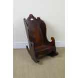 A 19th Century Child's Rocking chair with shaped top, solid seat