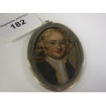 A painted Portrait Miniature of young man in green jacket in white metal frame