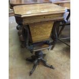An early Victorian rosewood Work Table with hinged lid, floral and scroll marquetry, scroll