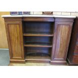 A 19th Century mahogany Bookcase/Cabinet of inverted break-front form with white marble top over