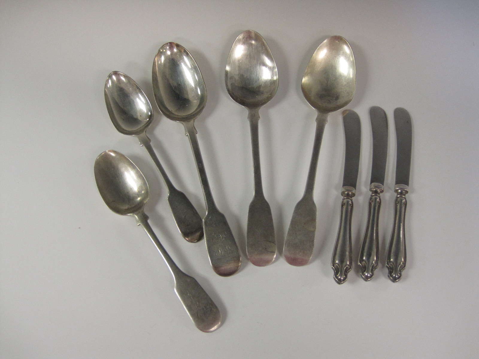 Three Victorian silver Table Spoons fiddle pattern, London 1838, two Dessert Spoons, and three Tea