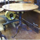 An antique circular tripod Table with bird-cage support on pad feet