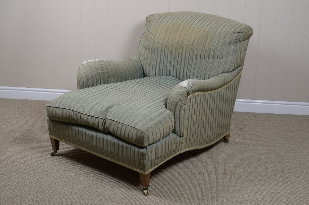 A Howard & Sons of London, Easy Chair, upholstered in green stripe on square taper supports with