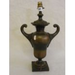 A heavy bronze urn shaped lamp base with