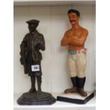 A resin model of an Edwardian golfer, to