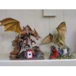 Two resin figural groups of dragons, to