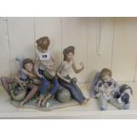 Two Lladro figural groups, one of a boy