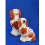 Two Staffordshire figures of spaniels.