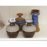 Four Doulton bud vases of different colo