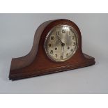 An Oak Mantel Clock.
