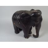 A Heavy Carved Wooden Elephant.