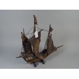 A Wooden Model of A Three Masted Ship.