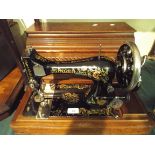 A Cased Singer Sewing Machine.