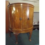 An Edwardian Walnut Bow Fronted Cabinet