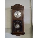 An Edwardian Wall Clock.