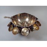 A Silver Plated Punch Bowl, Silver Plated Ladle and Twelve Silver Plated Cups.